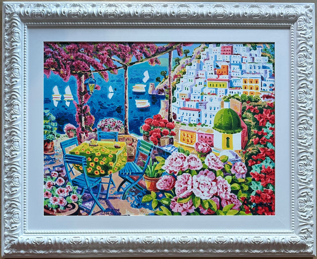 Opera incorniciata: Le sedie azzurre nella luce di Positano | Athos Faccincani